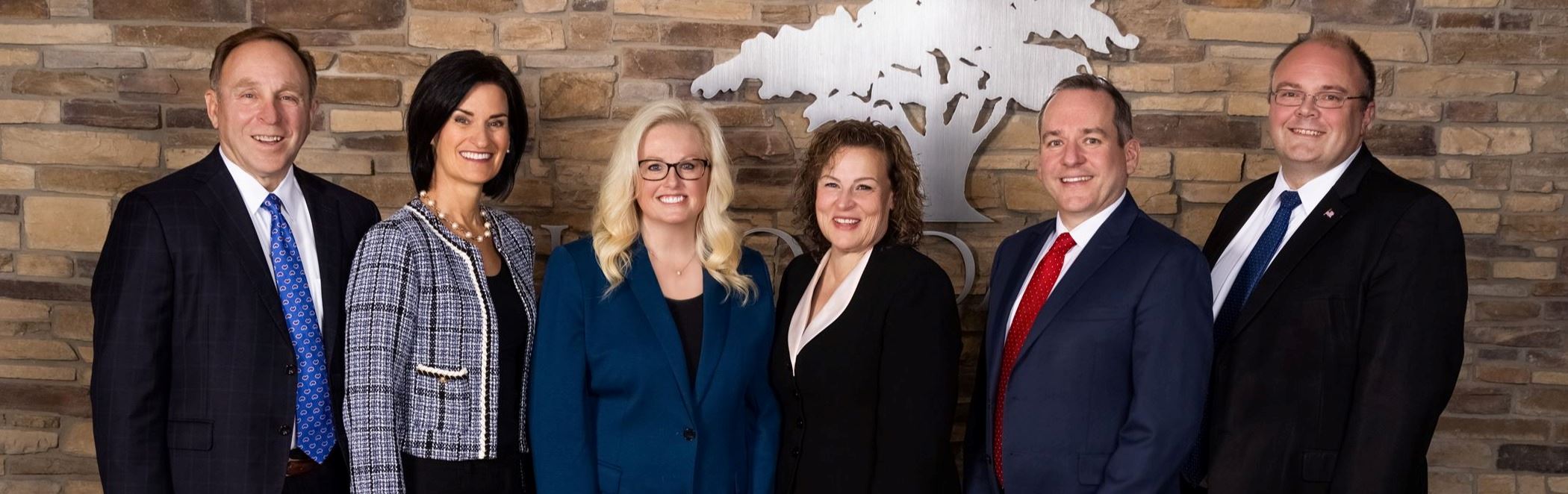 Group portrait with South Jordan City Council members and Mayor Dawn Ramsey in front of City Logo